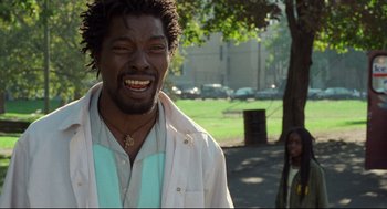 Movie still from “Ghost Dog: The Way of the Samurai” (1999), directed by Jim Jarmusch – A man with a beard is smiling for the camera; Close Up shot, Low angle