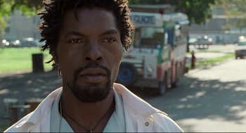 Movie still from “Ghost Dog: The Way of the Samurai” (1999), directed by Jim Jarmusch – A person wearing a white shirt; Close Up shot, Low angle