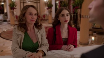 Movie still from “Emily in Paris” (2020), created by Darren Star – Two women sitting at a table in front of each other; Medium shot, Over the shoulder angle