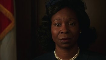 Movie still from “Ghosts of Mississippi” (1996), directed by Rob Reiner – An older woman wearing a pearl necklace and pearls; Close Up shot, Low angle