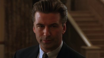 Movie still from “Ghosts of Mississippi” (1996), directed by Rob Reiner – A person wearing a suit and tie; Close Up shot, Low angle