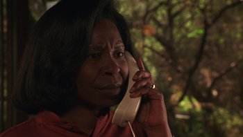 Movie still from “Ghosts of Mississippi” (1996), directed by Rob Reiner – An older black woman talking on a phone; Close Up shot, Low angle