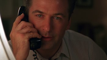 Movie still from “Ghosts of Mississippi” (1996), directed by Rob Reiner – A person talking on a phone; Close Up shot, Low angle