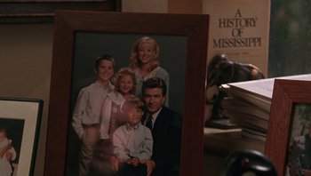 Movie still from “Ghosts of Mississippi” (1996), directed by Rob Reiner – A picture of a family in a picture frame; Extreme Close Up shot, High angle