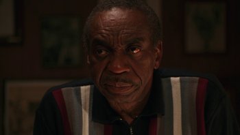 Movie still from “Ghosts of Mississippi” (1996), directed by Rob Reiner – An older man is looking at the camera; Close Up shot, Low angle