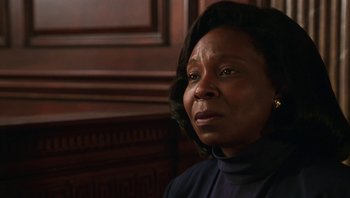 Movie still from “Ghosts of Mississippi” (1996), directed by Rob Reiner – An older black woman looking at the camera; Close Up shot, Low angle