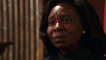 Movie still from “Ghosts of Mississippi” (1996), directed by Rob Reiner – An older black woman looking at the camera; Close Up shot, Low angle
