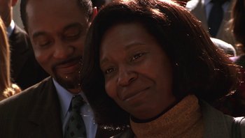 Movie still from “Ghosts of Mississippi” (1996), directed by Rob Reiner – A man and a woman smiling for the camera; Close Up shot, Low angle