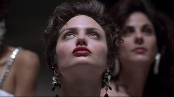 Movie still from “Gia” (1998), directed by Michael Cristofer – A person wearing a dress; Close Up shot, Low angle