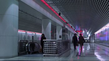 Movie still from “Gia” (1998), directed by Michael Cristofer – People are standing in a train station waiting to board a train; Extreme Wide shot, High angle