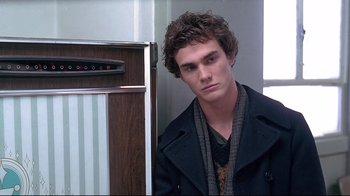 Movie still from “Gia” (1998), directed by Michael Cristofer – A young man standing in front of an open refrigerator; Close Up shot, Over the shoulder angle