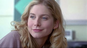 Movie still from “Gia” (1998), directed by Michael Cristofer – A person with blonde curly hair; Close Up shot, Over the shoulder angle