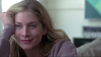 Movie still from “Gia” (1998), directed by Michael Cristofer – A person with long blonde hair; Close Up shot, Over the shoulder angle