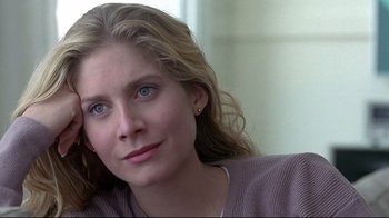 Movie still from “Gia” (1998), directed by Michael Cristofer – A person with long blonde hair; Close Up shot, Over the shoulder angle