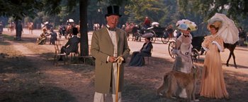 Movie still from “Gigi” (1958), directed by Vincente Minnelli – An old man wearing a top hat and holding a cane; Medium shot, Over the shoulder angle