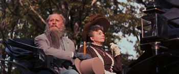 Movie still from “Gigi” (1958), directed by Vincente Minnelli – An older man sitting next to an older woman; Medium shot, Low angle