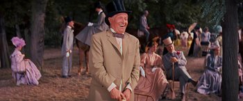 Movie still from “Gigi” (1958), directed by Vincente Minnelli – An older man in a top hat and a suit; Medium shot, Low angle