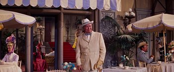 Movie still from “Gigi” (1958), directed by Vincente Minnelli – An older man wearing a suit and a hat; Medium shot, Low angle
