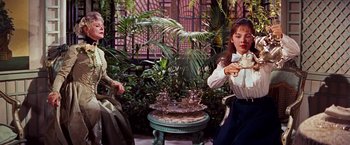 Movie still from “Gigi” (1958), directed by Vincente Minnelli – Two women sitting in a room next to each other; Medium shot, High angle