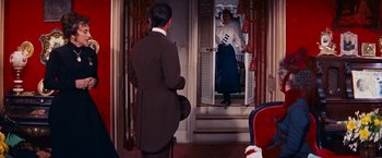 Movie still from “Gigi” (1958), directed by Vincente Minnelli – A man and a woman are looking in a mirror; Wide shot, Over the shoulder angle