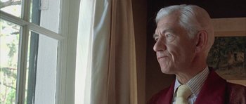 Movie still from “Gods and Monsters” (1998), directed by Bill Condon – An older man looking out of a window; Close Up shot, Low angle