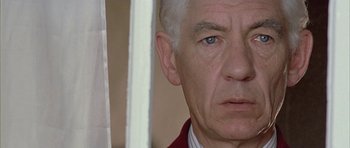 Movie still from “Gods and Monsters” (1998), directed by Bill Condon – An older man with white hair and blue eyes; Close Up shot, Low angle