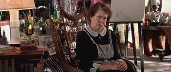 Movie still from “Gods and Monsters” (1998), directed by Bill Condon – An older woman sitting in a chair in a living room; Medium shot, High angle