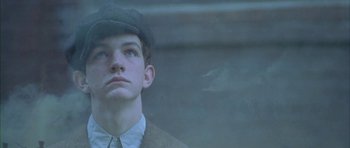 Movie still from “Gods and Monsters” (1998), directed by Bill Condon – A young man in a hat and a jacket; Close Up shot, Low angle