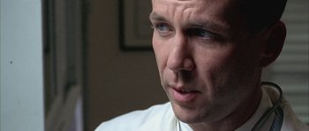 Movie still from “Gods and Monsters” (1998), directed by Bill Condon – A person wearing a white shirt; Close Up shot, Low angle
