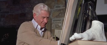 Movie still from “Gods and Monsters” (1998), directed by Bill Condon – An older man is painting a window frame; Close Up shot, Low angle