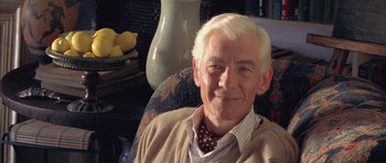 Movie still from “Gods and Monsters” (1998), directed by Bill Condon – An older man with white hair sitting in a chair; Close Up shot, Low angle