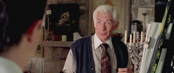 Movie still from “Gods and Monsters” (1998), directed by Bill Condon – An older man wearing a sweater and a tie; Close Up shot, Over the shoulder angle