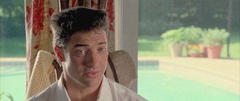 Movie still from “Gods and Monsters” (1998), directed by Bill Condon – A person sitting in a chair wearing a white shirt; Close Up shot, Over the shoulder angle