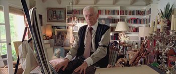 Movie still from “Gods and Monsters” (1998), directed by Bill Condon – An older man sitting in front of a computer; Medium shot, Low angle