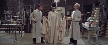 Movie still from “Gods and Monsters” (1998), directed by Bill Condon – A group of men standing next to each other in a room; Wide shot, Low angle