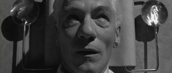 Movie still from “Gods and Monsters” (1998), directed by Bill Condon – An old man with a white beard and a white shirt; Close Up shot, Overhead angle