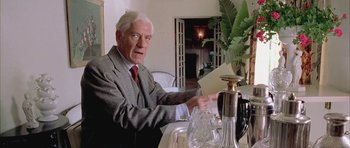 Movie still from “Gods and Monsters” (1998), directed by Bill Condon – An older man sitting at a dining room table; Close Up shot, Low angle