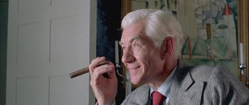 Movie still from “Gods and Monsters” (1998), directed by Bill Condon – An older man holding a cigar in his mouth; Close Up shot, Low angle
