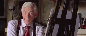 Movie still from “Gods and Monsters” (1998), directed by Bill Condon – An older man in a white shirt and a red tie; Close Up shot, Low angle