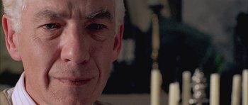 Movie still from “Gods and Monsters” (1998), directed by Bill Condon – An older man is looking at the camera; Extreme Close Up shot, Low angle