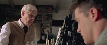 Movie still from “Gods and Monsters” (1998), directed by Bill Condon – A man and a woman in front of an easel in a room; Close Up shot, Over the shoulder angle