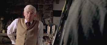 Movie still from “Gods and Monsters” (1998), directed by Bill Condon – An older man standing in front of an easel; Close Up shot, Over the shoulder angle
