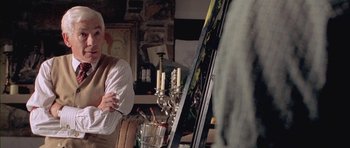 Movie still from “Gods and Monsters” (1998), directed by Bill Condon – A man standing in front of an easel in a room; Medium shot, Over the shoulder angle