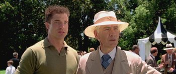 Movie still from “Gods and Monsters” (1998), directed by Bill Condon – A man and a man in a hat and a green shirt; Close Up shot, Low angle