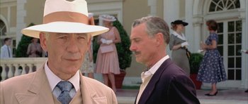 Movie still from “Gods and Monsters” (1998), directed by Bill Condon – A man in a suit and a man in a hat; Close Up shot, Over the shoulder angle