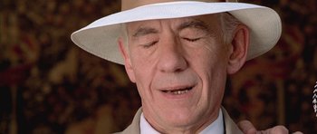 Movie still from “Gods and Monsters” (1998), directed by Bill Condon – An older man wearing a white hat with his eyes closed; Extreme Close Up shot, Low angle