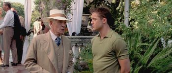 Movie still from “Gods and Monsters” (1998), directed by Bill Condon – A man in a hat talking to an older man in a suit; Medium shot, Over the shoulder angle