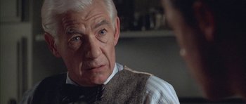 Movie still from “Gods and Monsters” (1998), directed by Bill Condon – An older man wearing a vest and a tie; Close Up shot, Over the shoulder angle
