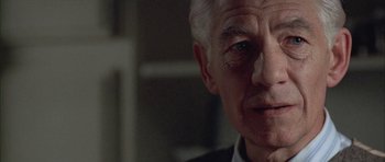 Movie still from “Gods and Monsters” (1998), directed by Bill Condon – An old man with a white beard and a black suit; Close Up shot, Low angle