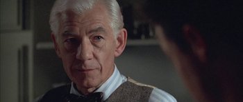 Movie still from “Gods and Monsters” (1998), directed by Bill Condon – An older man wearing a striped shirt and a tie; Close Up shot, Over the shoulder angle